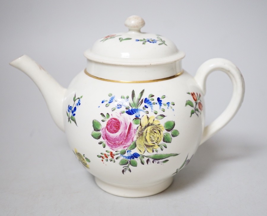 An 18th century Caughley teapot and cover with back to back roses, 15cms high including cover